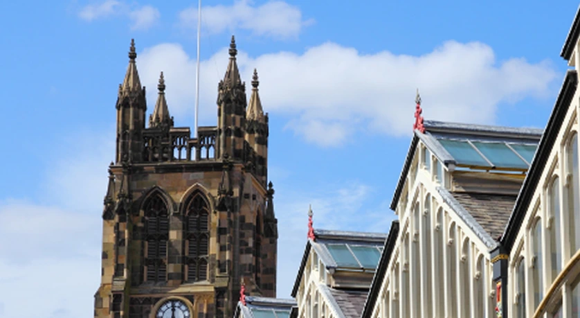Stockport town architecture showcasing heritage buildings and cultural landmarks under clear skies.